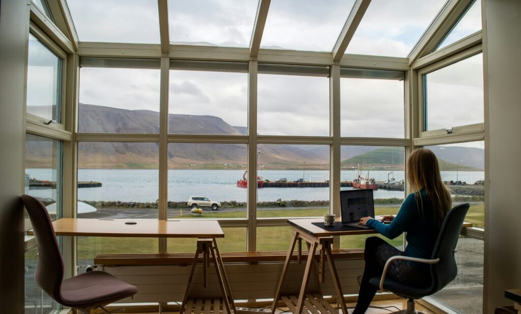Remote work by the window with mountain and lake view